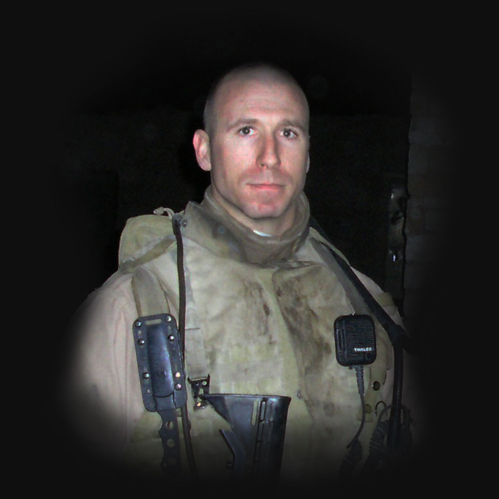 A young Gary Hess in combat gear during his Marine Corps service in Iraq